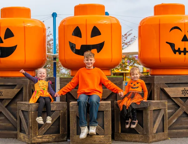 Kids In Front Of LEGO Pumpkin Heads Crop