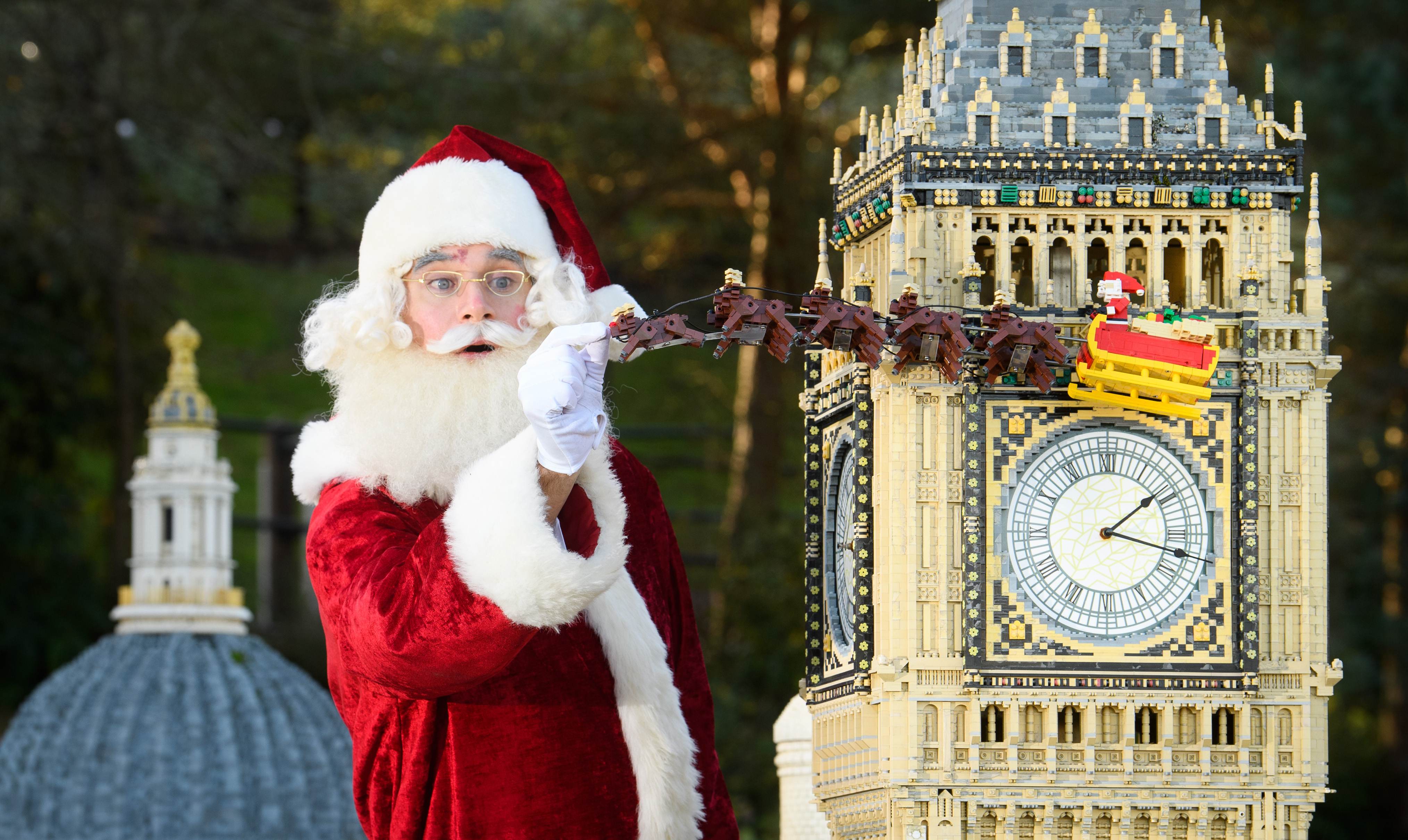 Father Christmas adding finishing touches to LEGO sleigh in front of Big Ben