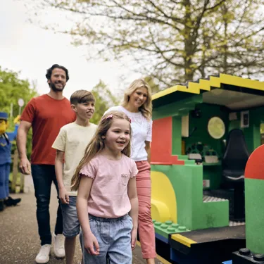 Family on platform of LEGOLAND Express train at LEGOLAND Windsor