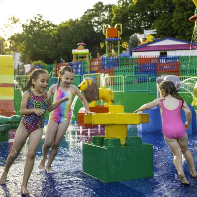 Kids splashing and playing in Splash Safari water splash play area at LEGOLAND Windsor