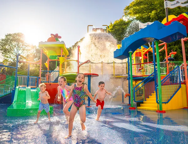 Kids laughing and playing in water at Drench Towers at LEGOLAND Windsor