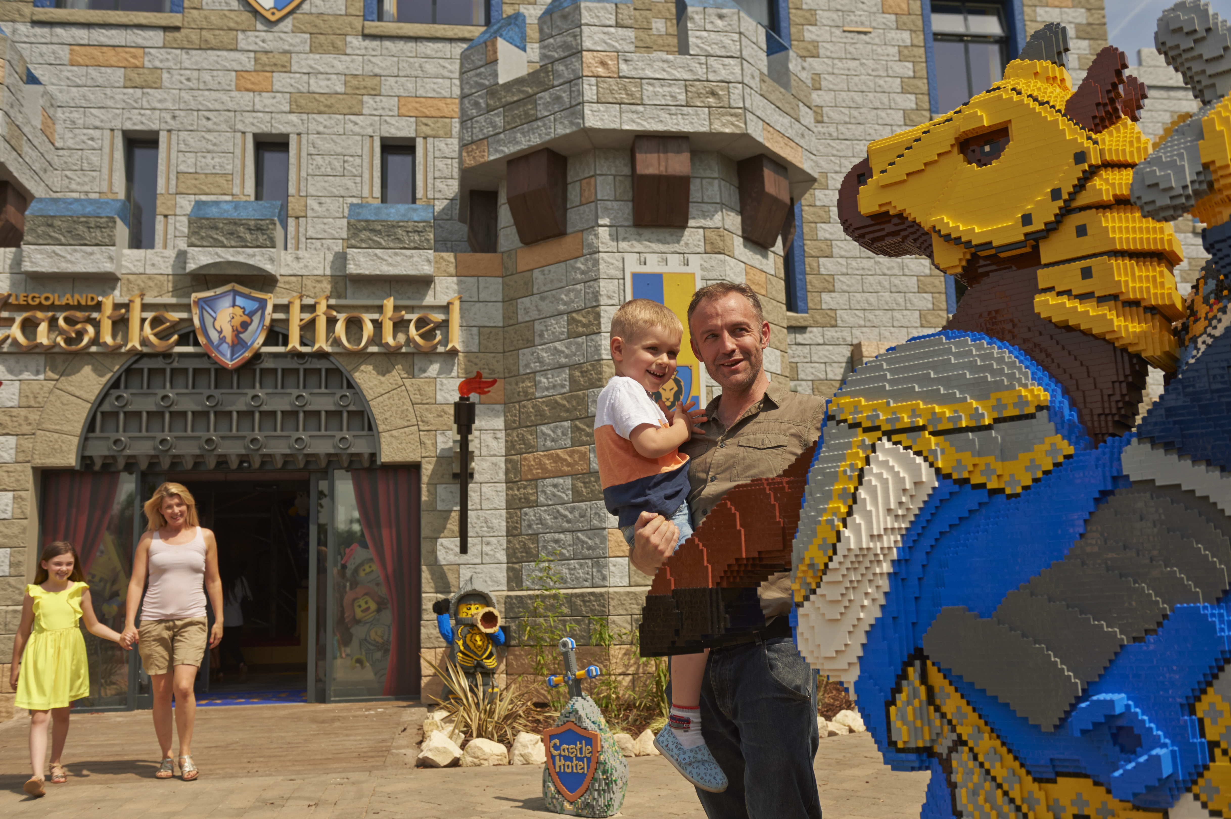 Father and son looking at LEGO model of a Horse and Knight outside the LEGOLAND Castle Hotel