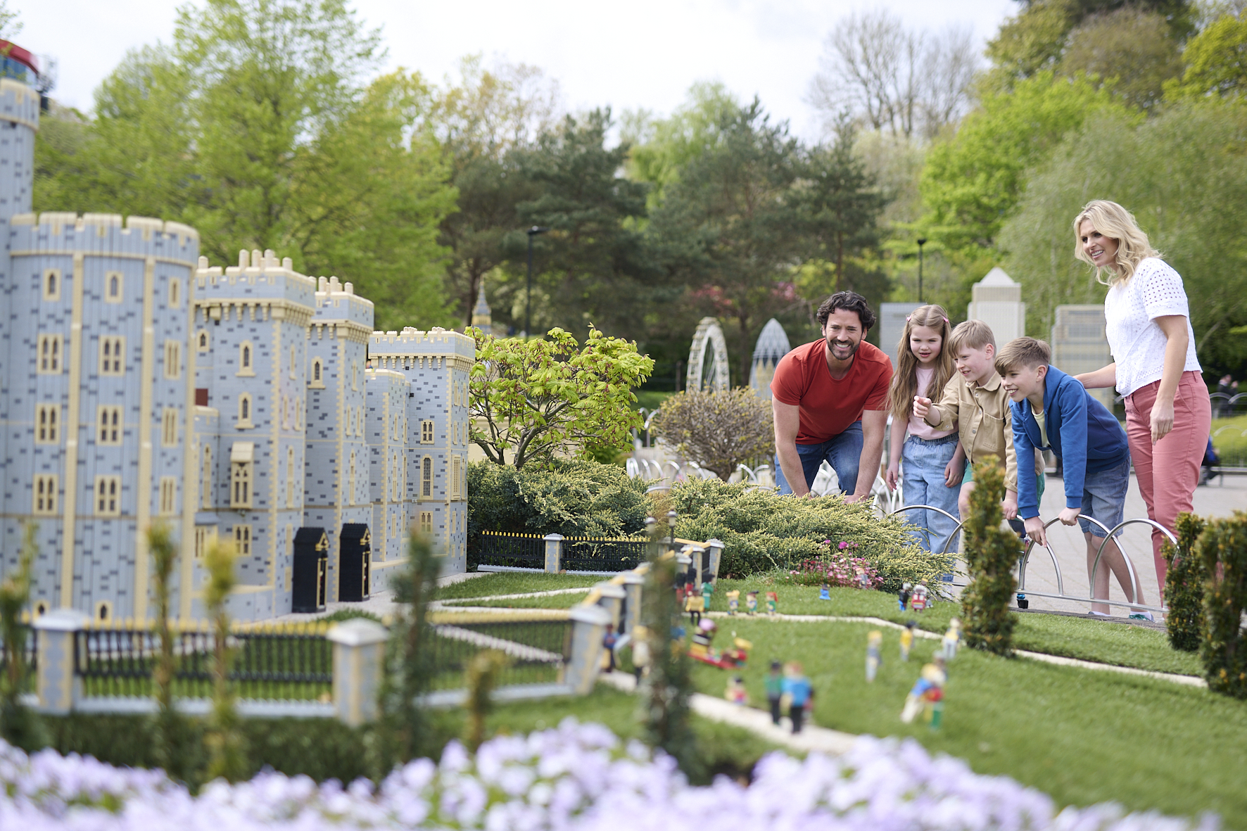 Family looking at Windsor Castle model in Miniland at LEGOLAND Windsor Resort