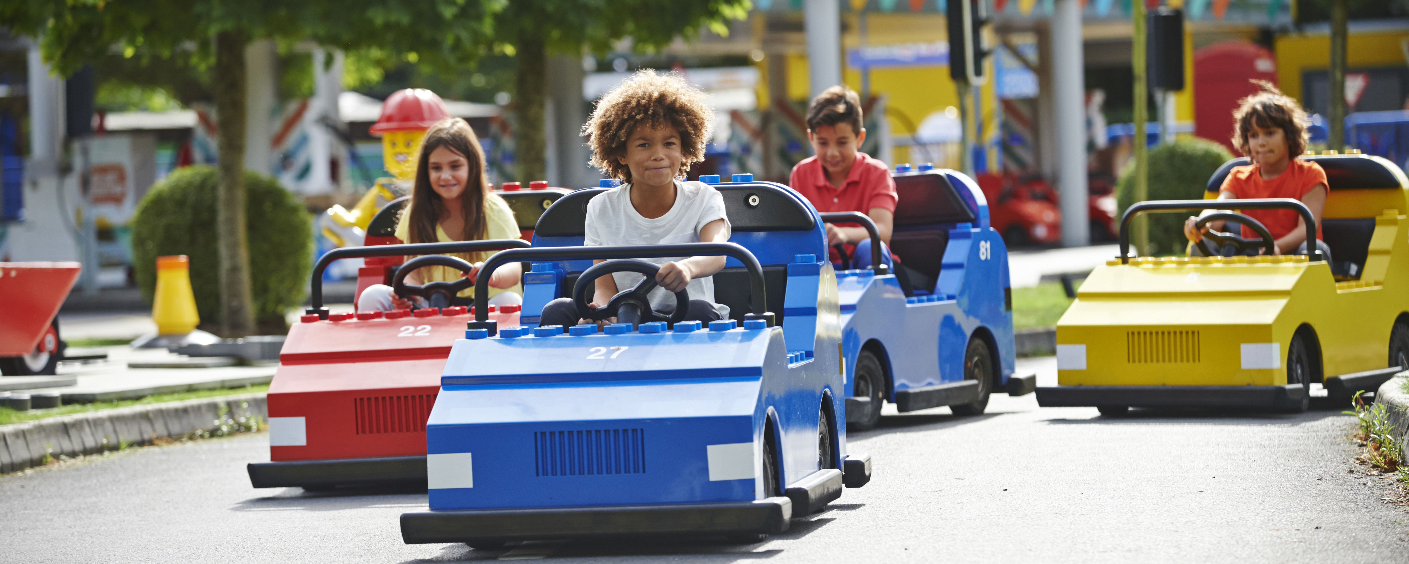 Boy driving cars on LEGO® City Driving School at LEGOLAND® Windsor Resort