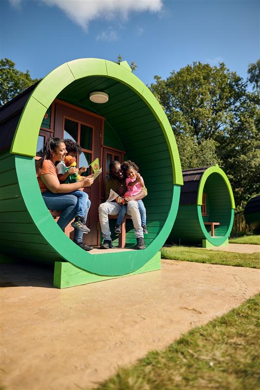 Family Outside Woodland Village Barrel